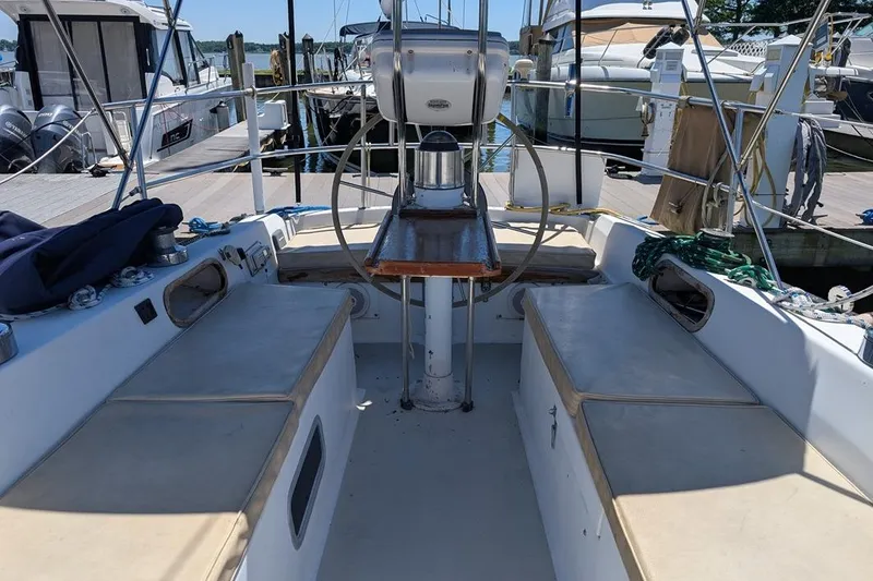 Slide: The Image of Cockpit of a 1985 Catalina 36 sailboat docked at a marina. - 80