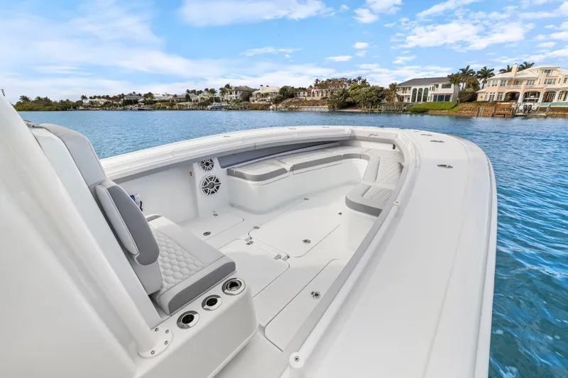 Slide: The Image of 2026 Yellowfin 32 Offshore boat with spacious seating, cruising on a scenic waterfront. - 31