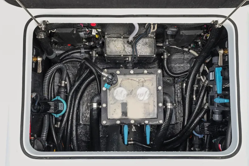 Slide: The Image of Engine compartment of 2026 Yellowfin 32 Offshore boat, showcasing complex wiring and components. - 38