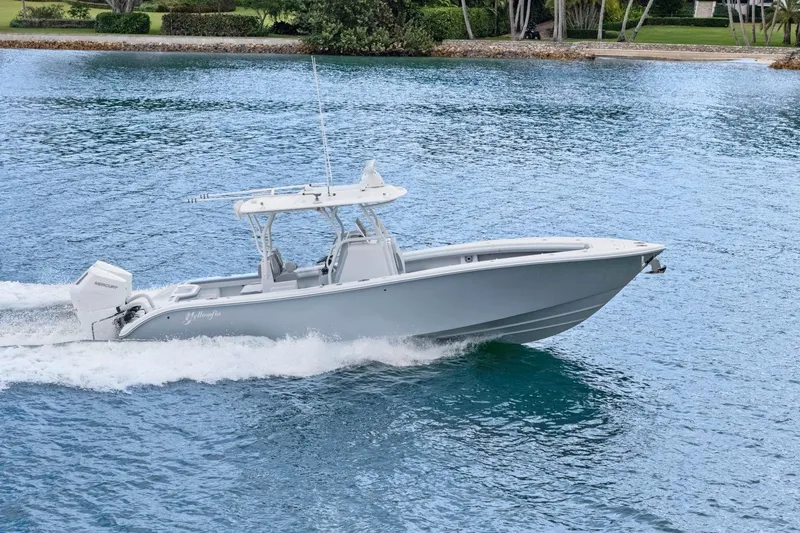 Slide: The Image of 2026 Yellowfin 32 Offshore boat cruising on blue water. - 48