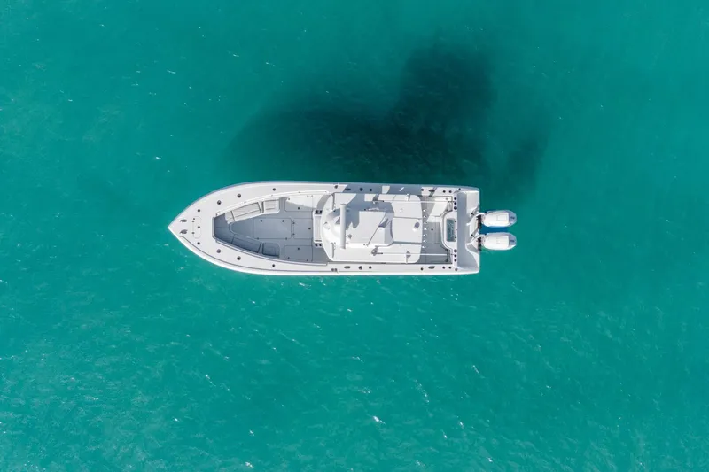 Slide: The Image of Aerial view of 2026 Yellowfin 32 Offshore boat on turquoise water. - 8