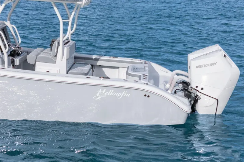 Slide: The Image of 2026 Yellowfin 32 Offshore boat with Mercury engine on blue ocean water. - 9