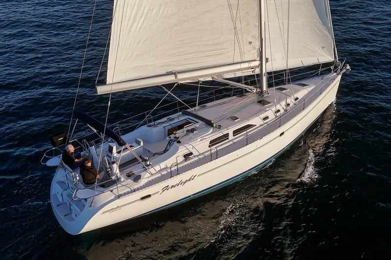 Slide: The Image of Sailing yacht Catalina 470, 1999 model, cruising on open water. - 11
