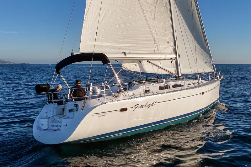 Slide: The Image of Sailing yacht Catalina 470, 1999 model, cruising on open water under clear skies. - 12