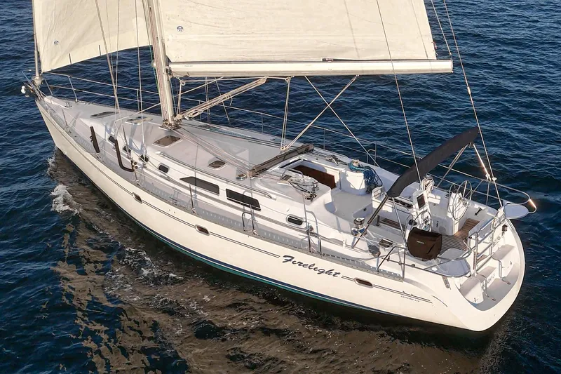 Slide: The Image of Sailing yacht Catalina 470, 1999 model, cruising on open water. - 18