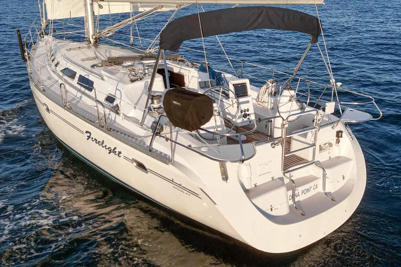 Slide: The Image of Sailing yacht Catalina 470, 1999 model, cruising on open water. - 19