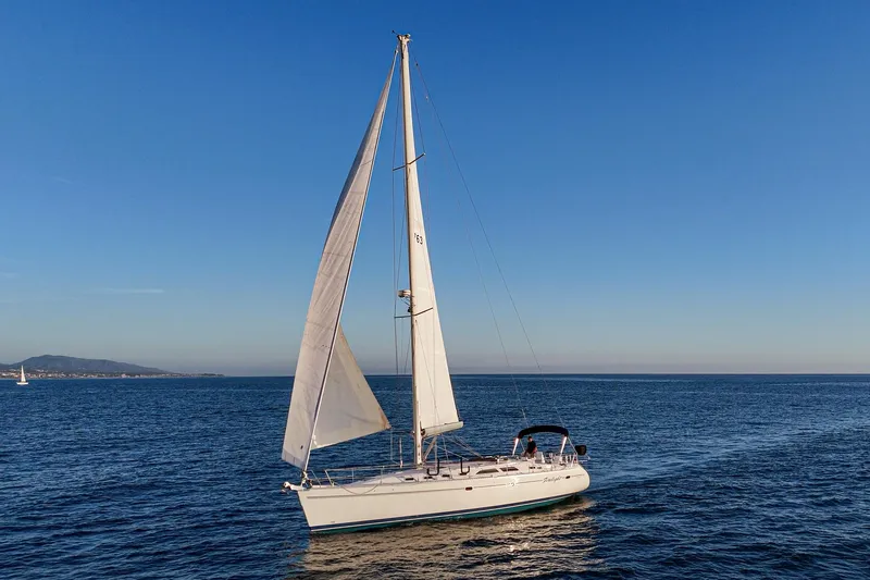 Slide: The Image of Sailing yacht Catalina 470, 1999 model, cruising on open sea under clear blue sky. - 3