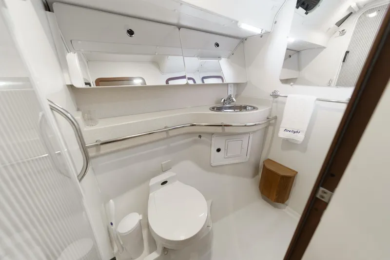 Slide: The Image of Bathroom interior of a 1999 Catalina 470 yacht, featuring modern fixtures and sleek design. - 41
