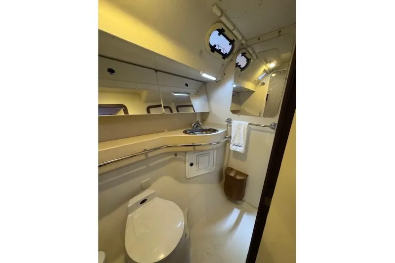 Slide: The Image of Bathroom interior of a 1999 Catalina 470 yacht, featuring sink and toilet. - 66