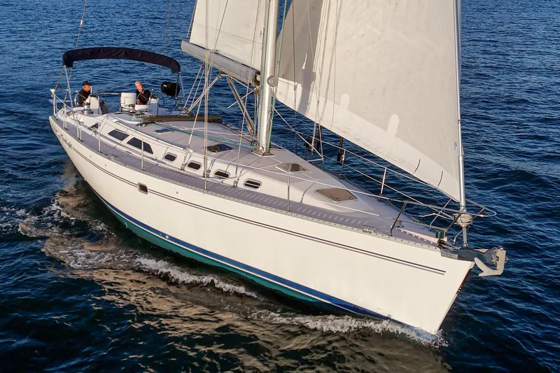 Slide: The Image of Sailing yacht Catalina 470, 1999 model, cruising on open water with full sails. - 8