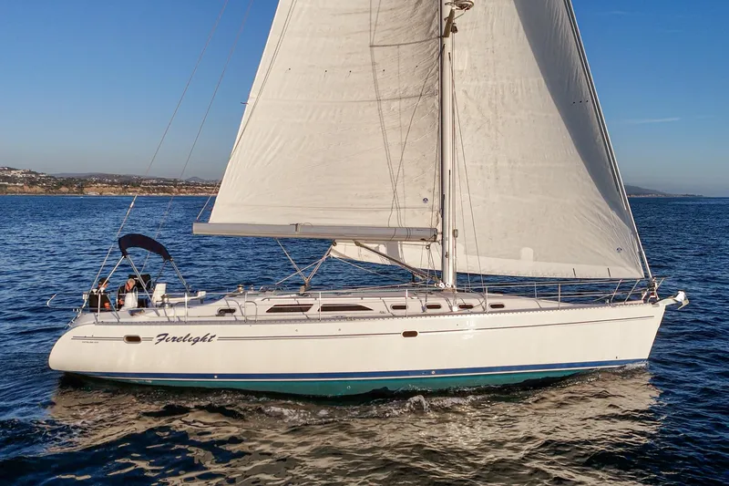 Slide: The Image of Sailing yacht Catalina 470, 1999 model, cruising on open water under clear skies. - 9