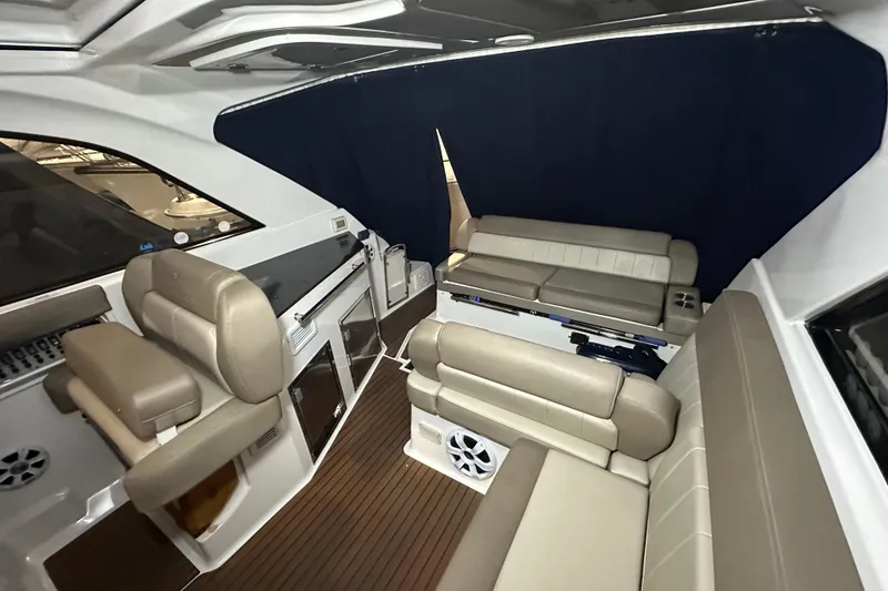 Slide: The Image of Interior of 2014 Regal 35 Sport Coupe with beige seating and wood flooring. - 5
