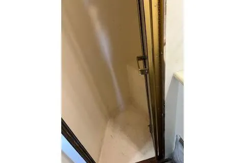 Slide: The Image of 1985 Ocean Yachts 38 Super Sport shower area with beige interior. - 17