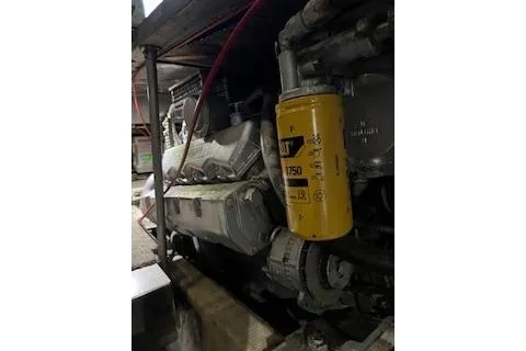 Slide: The Image of Engine room of 1985 Ocean Yachts 38 Super Sport with visible machinery and components. - 20