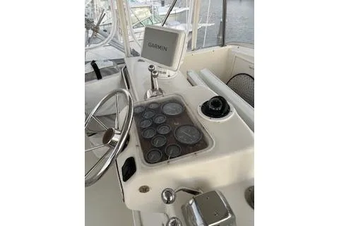 Slide: The Image of 1985 Ocean Yachts 38 Super Sport helm with Garmin navigation and instrument panel. - 5