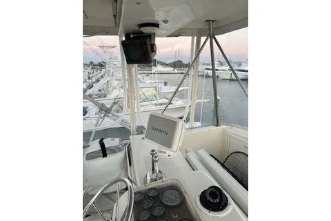 Slide: The Image of 1985 Ocean Yachts 38 Super Sport cockpit with Garmin navigation, docked at marina. - 6