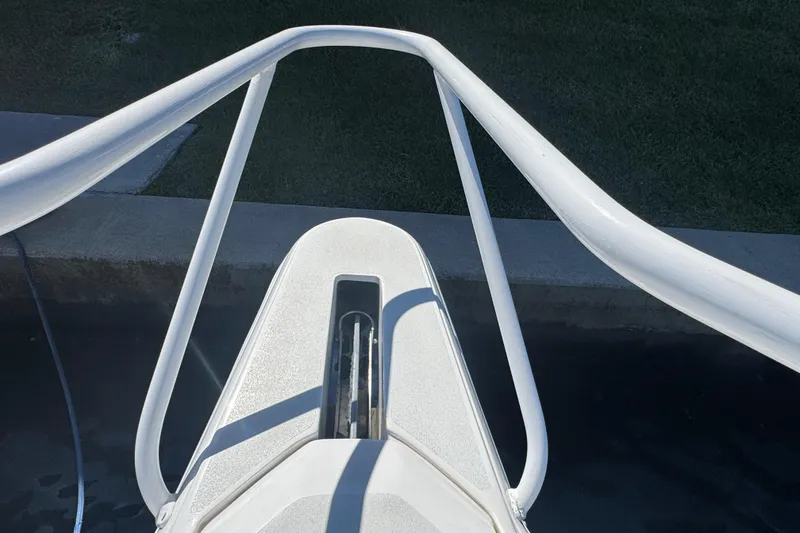 Slide: The Image of Bow view of 2012 Intrepid 390 Sport Yacht, featuring sleek white railings. - 11