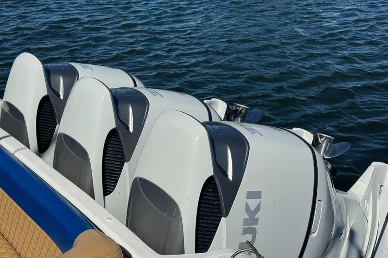 Slide: The Image of Triple Suzuki outboard engines on a 2012 Intrepid 390 Sport Yacht. - 24