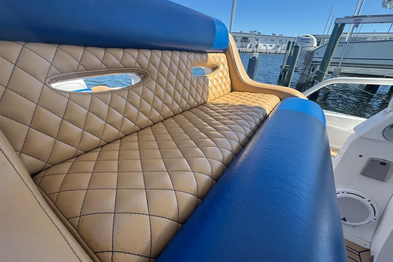 Slide: The Image of Luxurious seating on a 2012 Intrepid 390 Sport Yacht with quilted upholstery. - 27