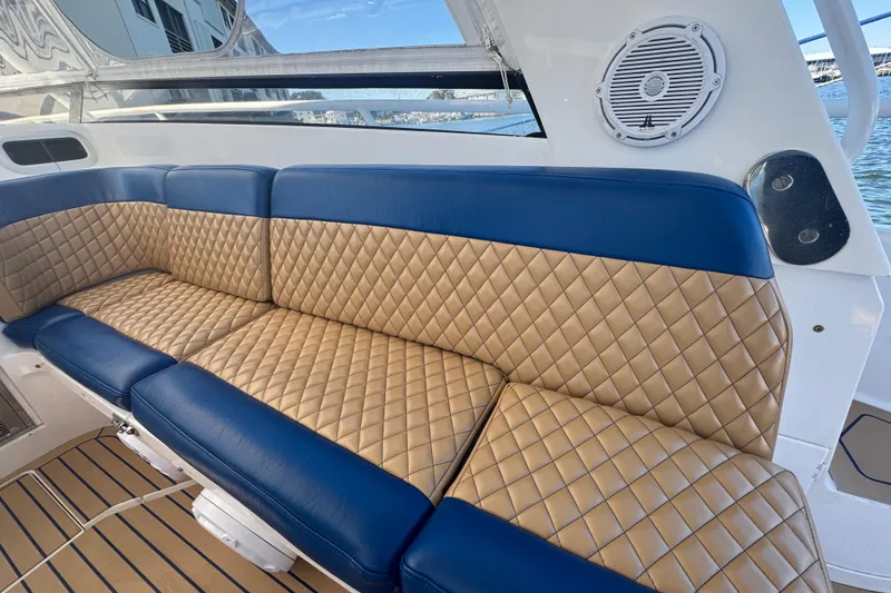 Slide: The Image of Luxurious seating on 2012 Intrepid 390 Sport Yacht with quilted upholstery and marine speaker. - 30
