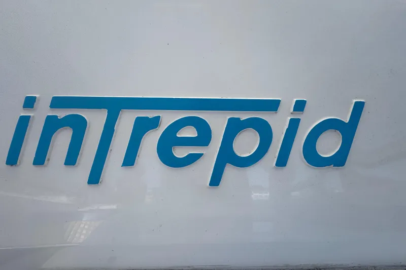 Slide: The Image of Intrepid 390 Sport Yacht 2012 logo in blue on white background. - 35