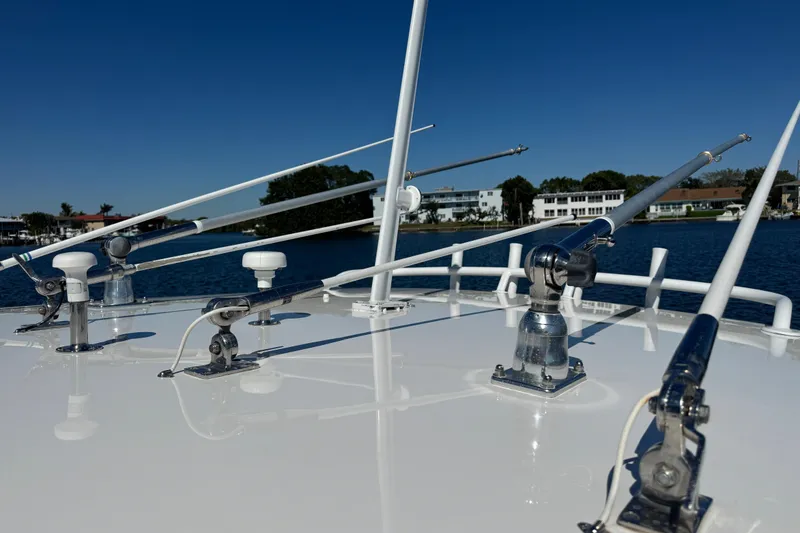 Slide: The Image of 2012 Intrepid 390 Sport Yacht deck with antennas, against a waterfront backdrop. - 41