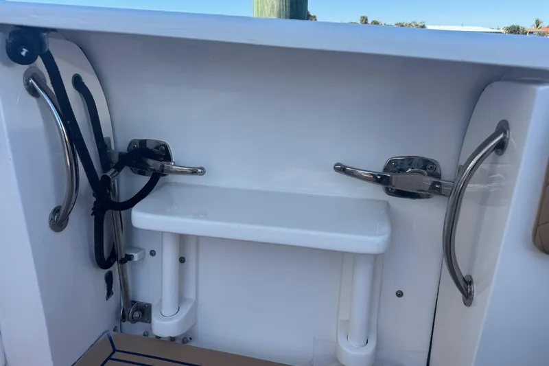 Slide: The Image of 2012 Intrepid 390 Sport Yacht interior with stainless steel fixtures and rope details. - 42