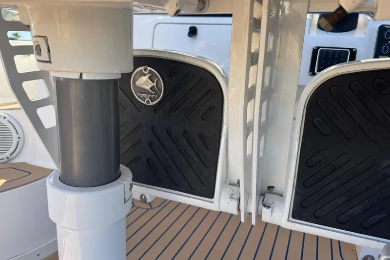 Slide: The Image of 2012 Intrepid 390 Sport Yacht helm with Pompanette footrests and control panel. - 43
