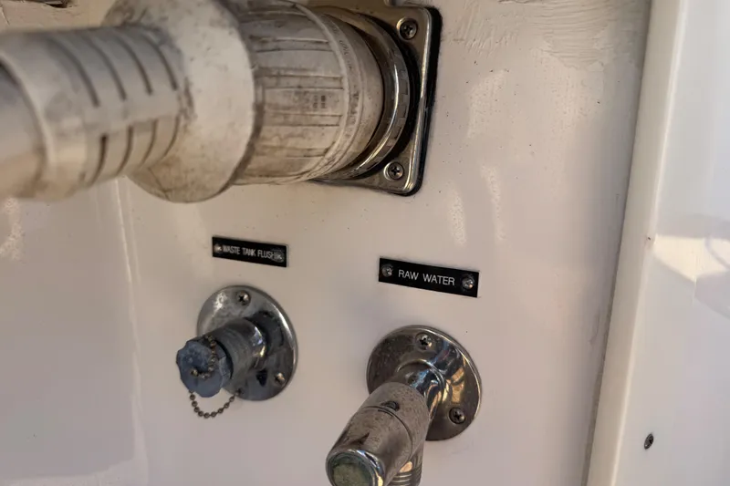 Slide: The Image of 2012 Intrepid 390 Sport Yacht waste tank flush and raw water connections. - 44