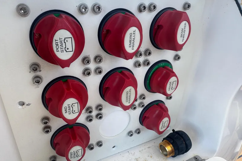 Slide: The Image of Control panel with red switches on a 2012 Intrepid 390 Sport Yacht. - 45