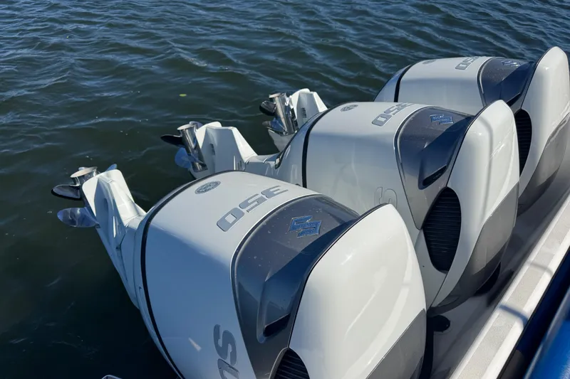 Slide: The Image of Triple outboard engines on a 2012 Intrepid 390 Sport Yacht in water. - 50