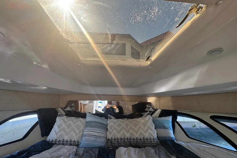 Slide: The Image of Interior of 2012 Intrepid 390 Sport Yacht with sunroof and cozy bedding. - 56