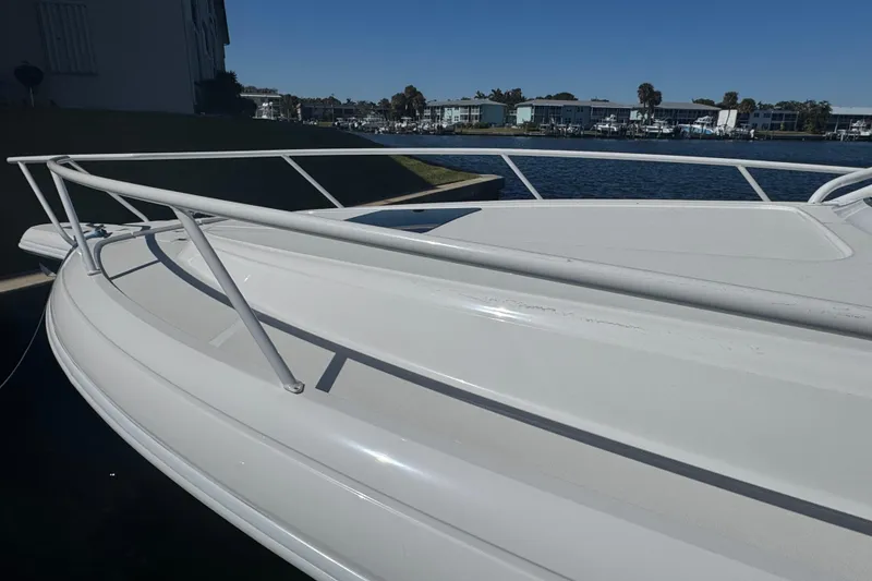 Slide: The Image of 2012 Intrepid 390 Sport Yacht docked by waterfront buildings. - 6