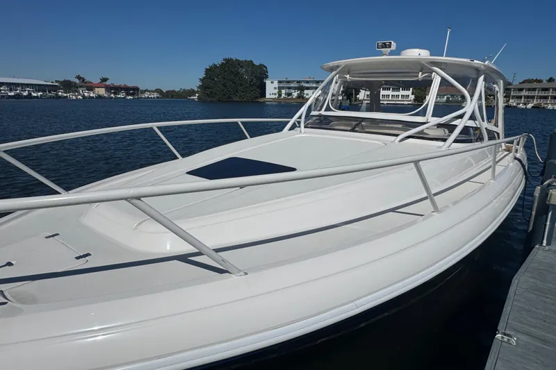 Slide: The Image of 2012 Intrepid 390 Sport Yacht docked on a sunny day. - 7