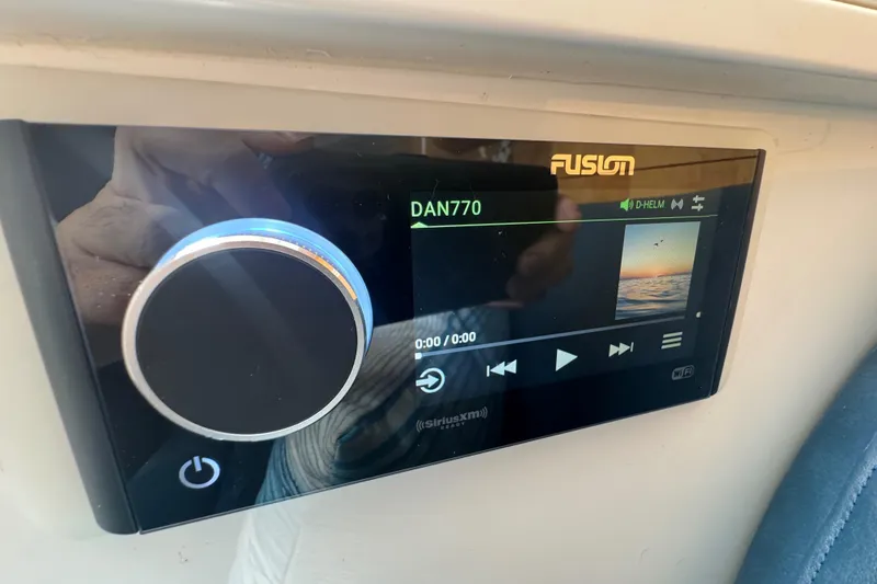 Slide: The Image of Fusion stereo system on 2012 Intrepid 390 Sport Yacht dashboard. - 73