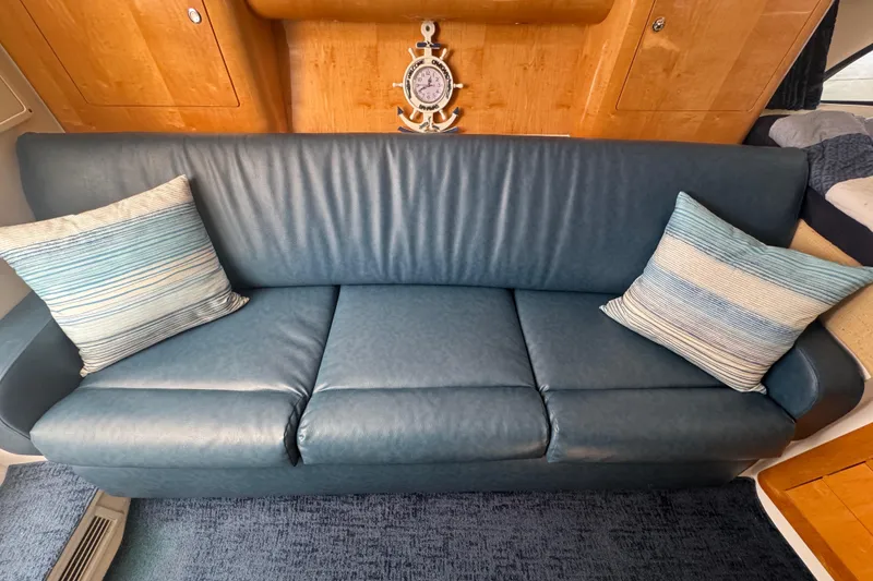 Slide: The Image of Blue leather sofa with striped cushions in 2012 Intrepid 390 Sport Yacht interior. - 74
