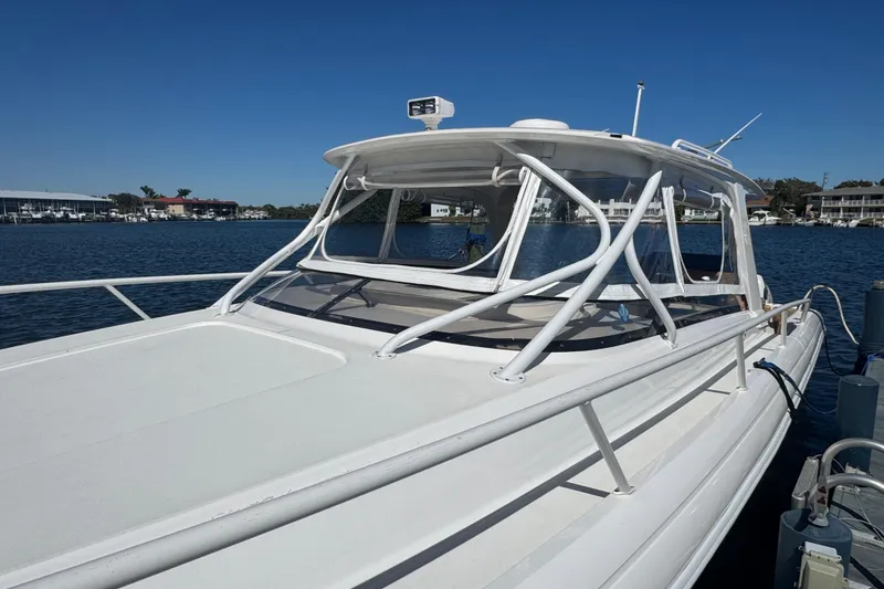 Slide: The Image of 2012 Intrepid 390 Sport Yacht docked on a sunny day. - 8