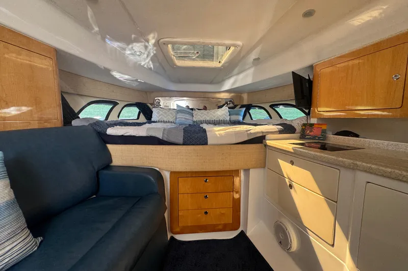 Slide: The Image of Interior of 2012 Intrepid 390 Sport Yacht with cozy bed and seating area. - 80