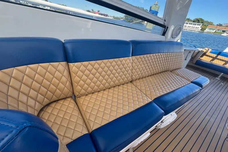 Slide: The Image of Luxurious seating on 2012 Intrepid 390 Sport Yacht with quilted upholstery and scenic water view. - 83