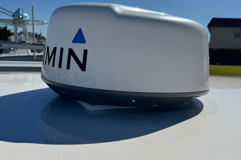 Slide: The Image of Garmin radar on 2012 Intrepid 390 Sport Yacht under clear blue sky. - 85
