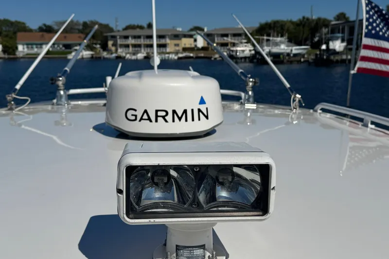 Slide: The Image of 2012 Intrepid 390 Sport Yacht with Garmin radar and American flag on deck. - 88