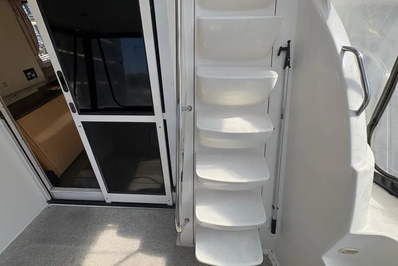 Slide: The Image of Staircase and door on 2001 Bayliner 3488 Command Bridge Motoryacht. - 10