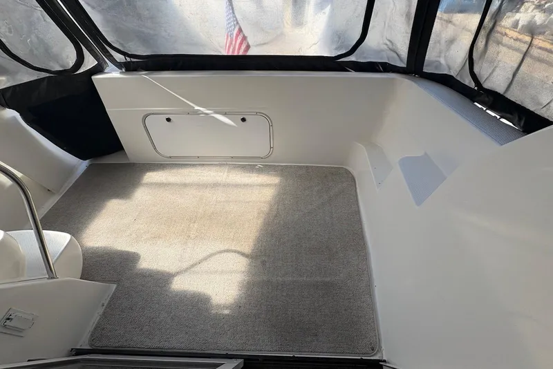 Slide: The Image of Interior of 2001 Bayliner 3488 Command Bridge Motoryacht with carpeted flooring and seating. - 11