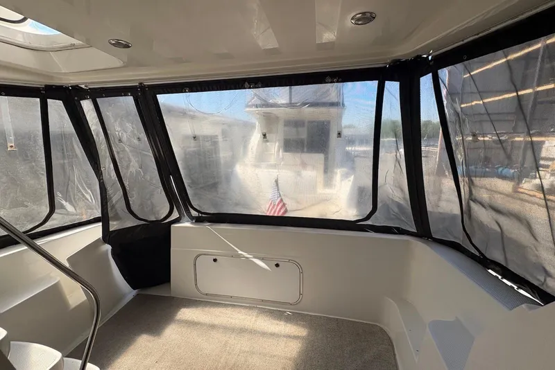 Slide: The Image of Interior view of 2001 Bayliner 3488 Command Bridge Motoryacht with enclosed windows. - 12