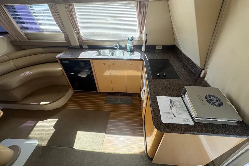Slide: The Image of Interior of 2001 Bayliner 3488 Command Bridge Motoryacht with kitchen and seating area. - 20