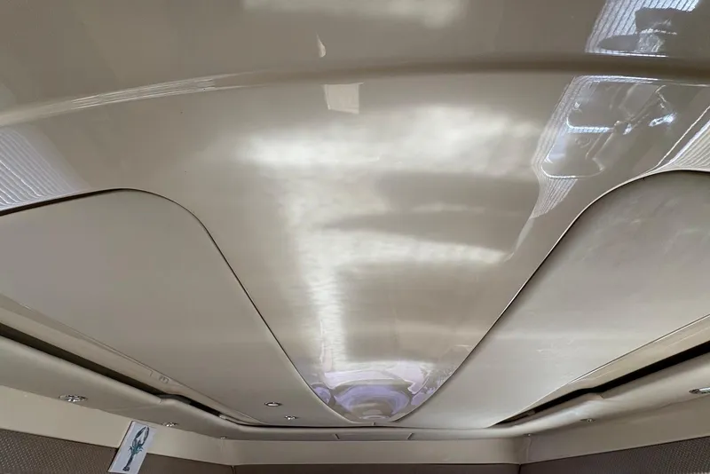 Slide: The Image of Interior ceiling of a 2001 Bayliner 3488 Command Bridge Motoryacht, featuring sleek design. - 22