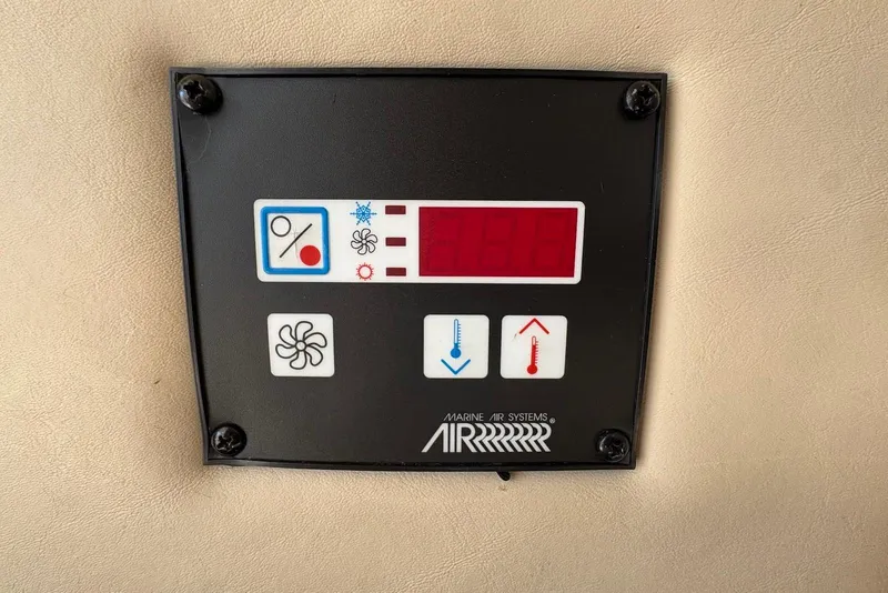 Slide: The Image of Control panel of a 2001 Bayliner 3488 Command Bridge Motoryacht's marine air system. - 23