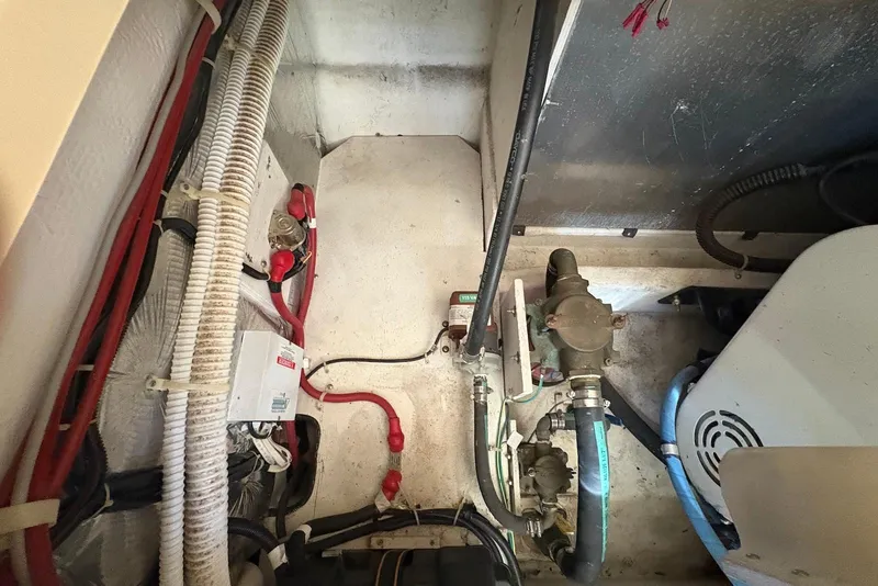 Slide: The Image of Engine compartment of 2001 Bayliner 3488 Command Bridge Motoryacht with visible wiring and components. - 30
