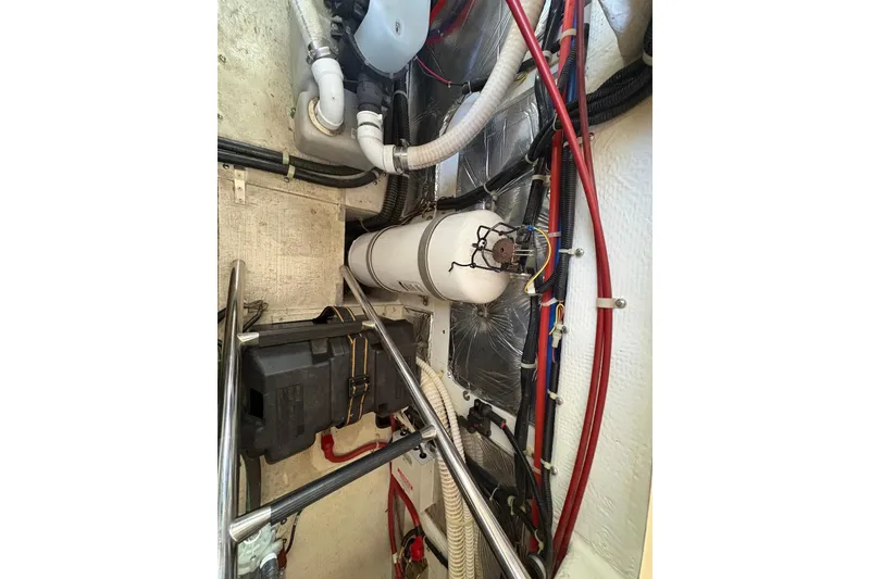 Slide: The Image of Engine room of 2001 Bayliner 3488 Command Bridge Motoryacht with visible wiring and components. - 32