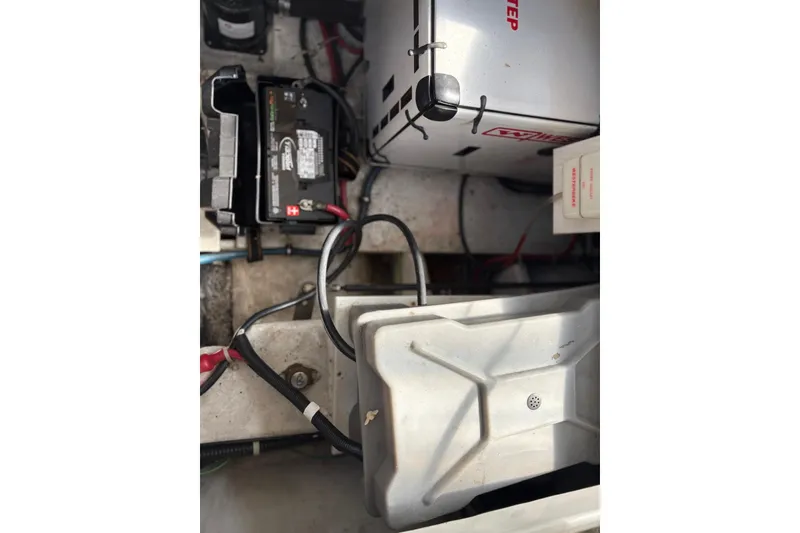 Slide: The Image of Engine compartment of 2001 Bayliner 3488 Command Bridge Motoryacht showing battery and wiring. - 33